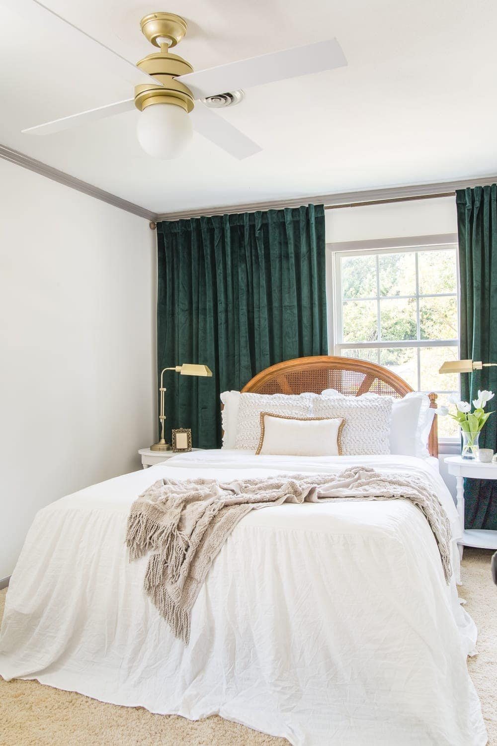 Guest bedroom makeover with linen skirted vintage style bedding and thrifted cane headboard