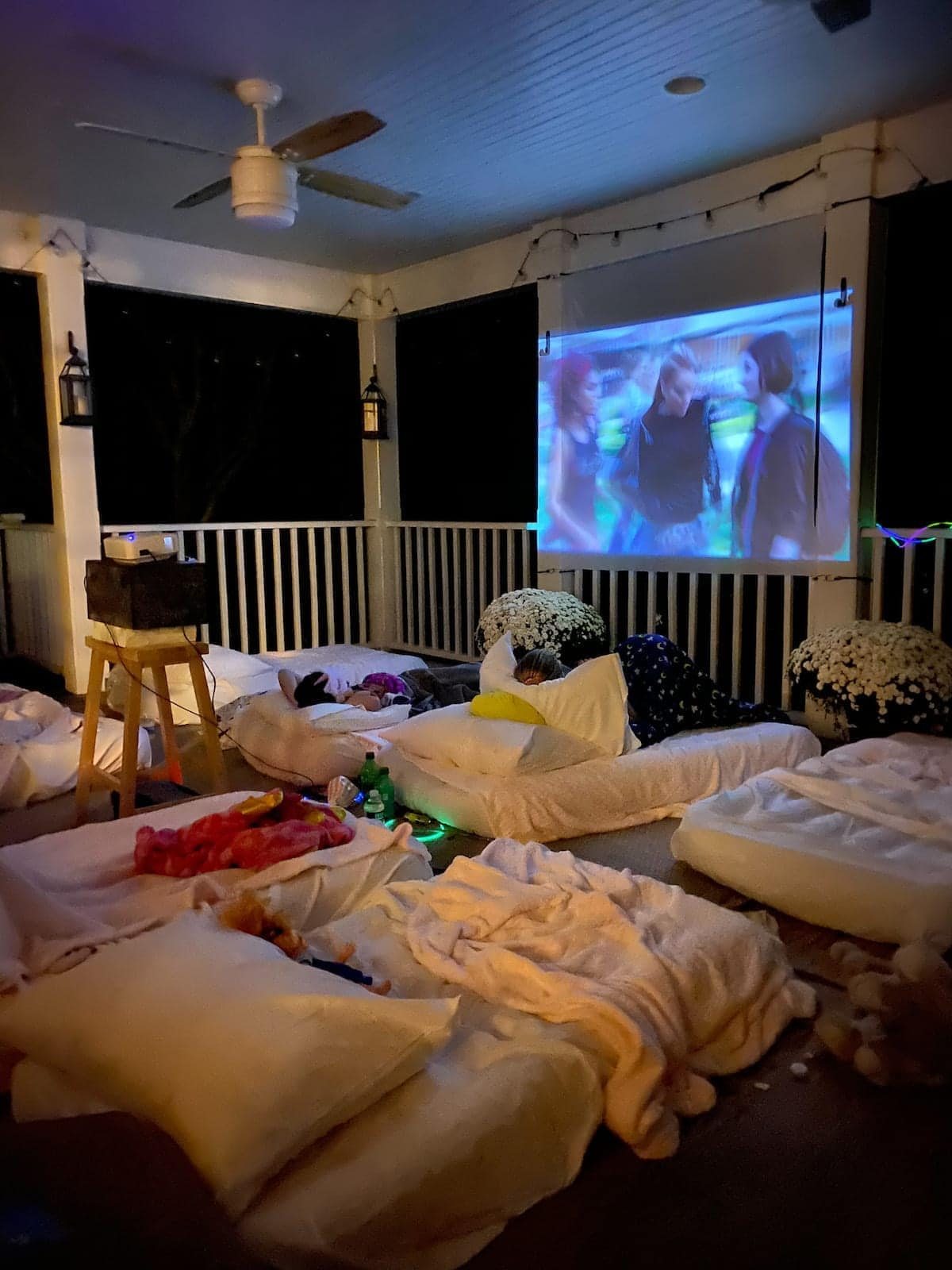 outside movie night set up on a back porch for a birthday sleepover party