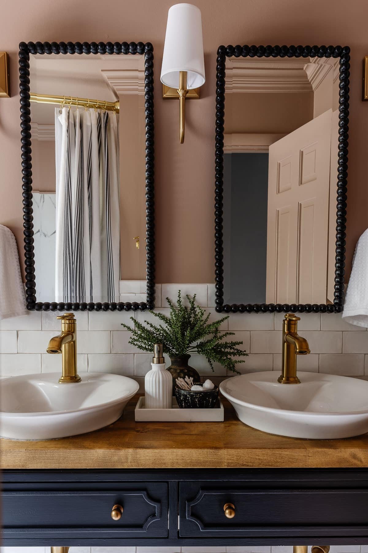 mauve bathroom walls with black vanity