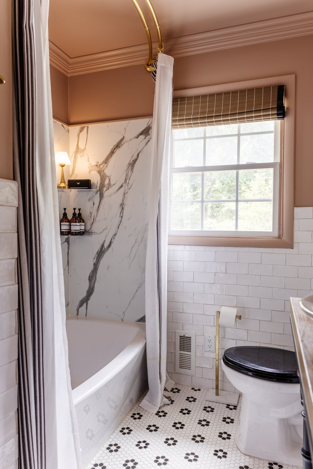 shower lamp on a shelf with cozy bathroom decor