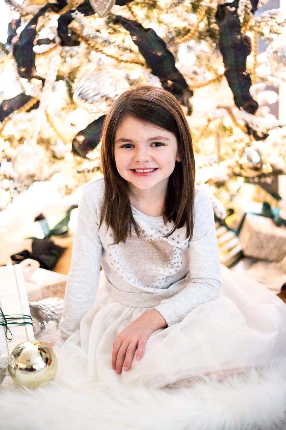 how to take your own christmas family photos in front of your tree