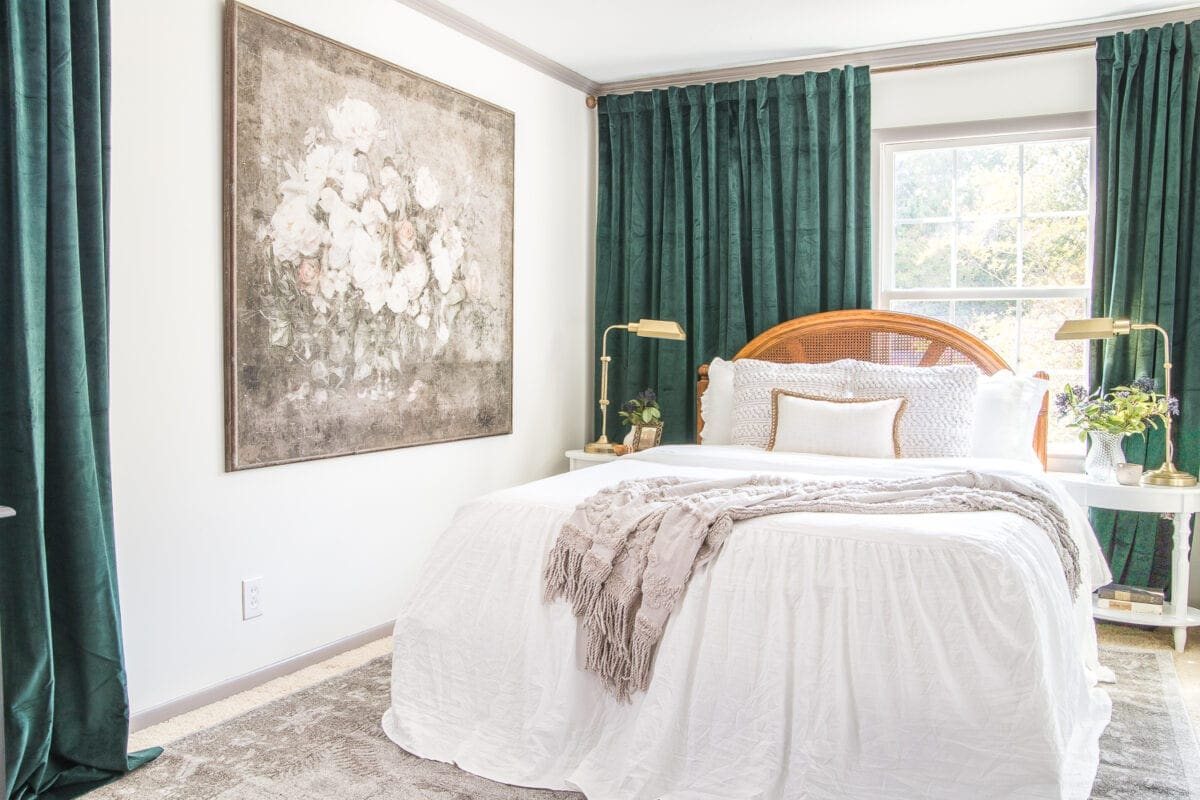 A boring guest bedroom gets a luxe, vintage chic makeover using thrifty projects, budget finds, and simple decorating tricks to maximize style and space. #guestbedroom #bedroominspiration #bedroomdecor