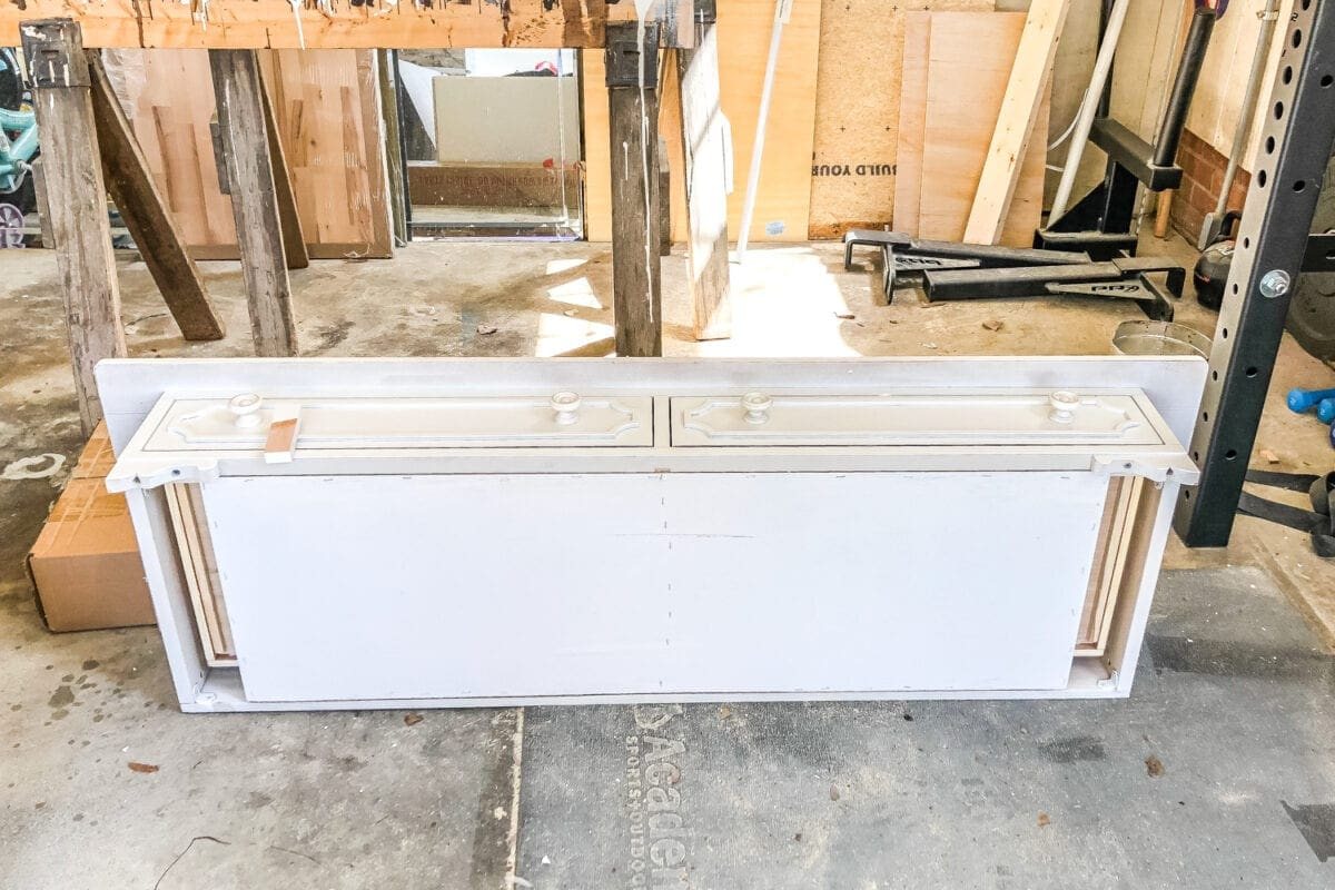How to Turn a Console Table Into a Bathroom Vanity | unigumushane.com - A tutorial for how to reconstruct a console table to repurpose as a bathroom vanity and leave drawers functional underneath sinks.