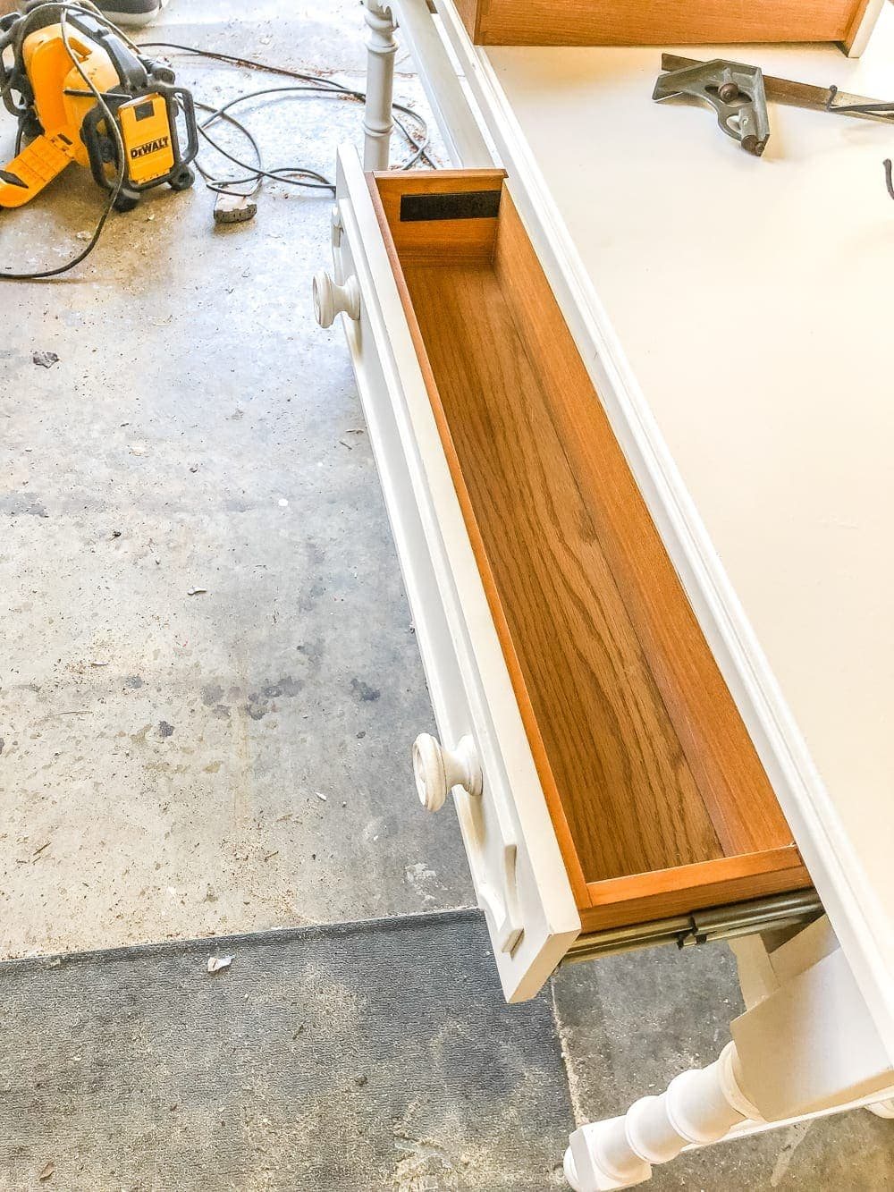 How to Turn a Console Table Into a Bathroom Vanity | unigumushane.com - A tutorial for how to reconstruct a console table to repurpose as a bathroom vanity and leave drawers functional underneath sinks.