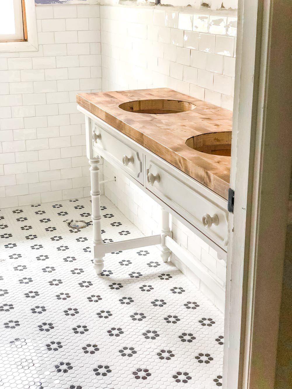 How to Turn a Console Table Into a Bathroom Vanity | unigumushane.com - A tutorial for how to reconstruct a console table to repurpose as a bathroom vanity and leave drawers functional underneath sinks.