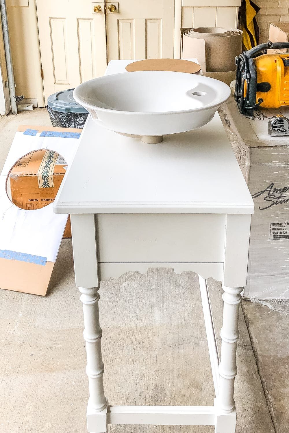 How to Turn a Console Table Into a Bathroom Vanity | unigumushane.com - A tutorial for how to reconstruct a console table to repurpose as a bathroom vanity and leave drawers functional underneath sinks.