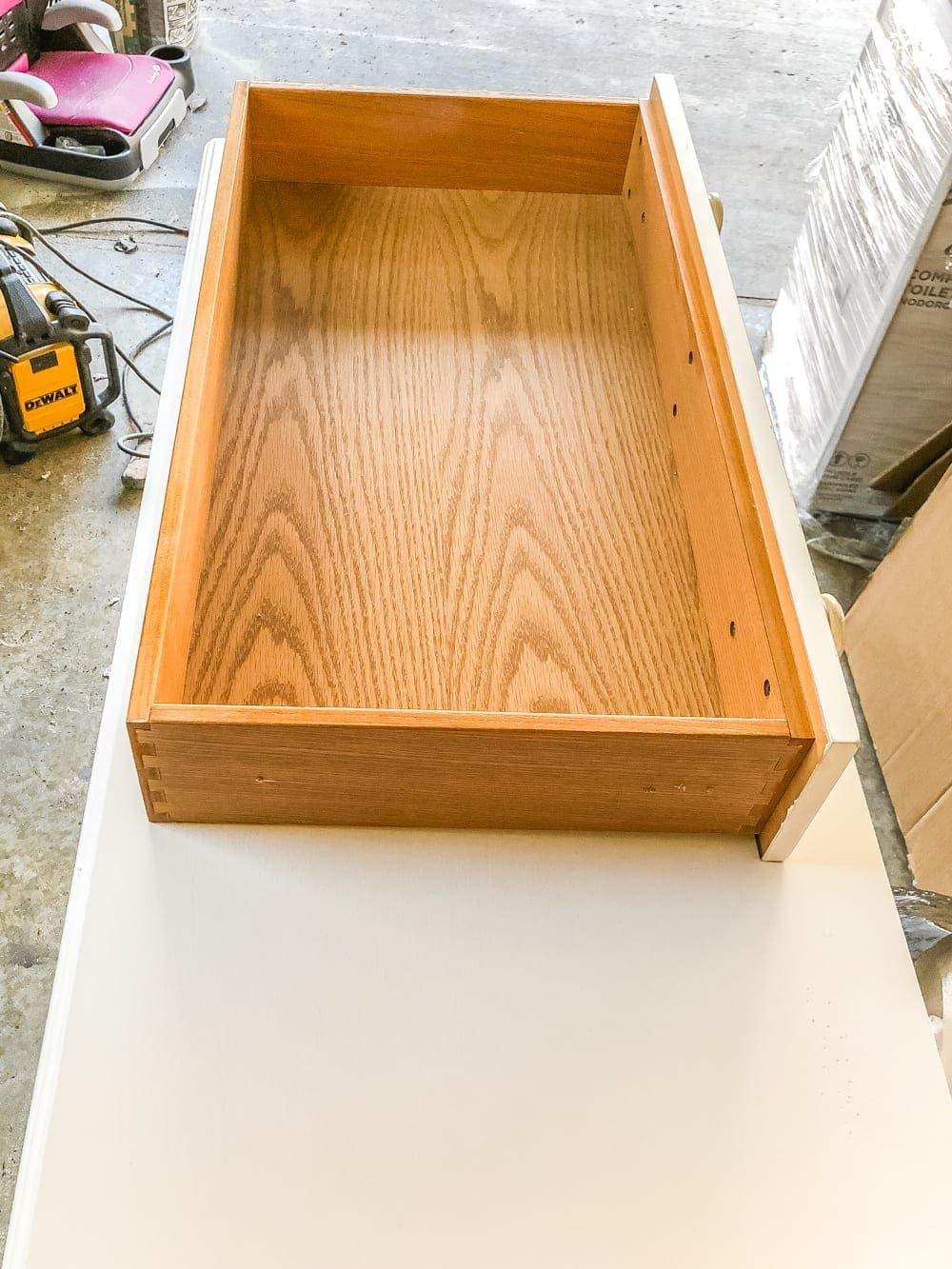 How to Turn a Console Table Into a Bathroom Vanity | unigumushane.com - A tutorial for how to reconstruct a console table to repurpose as a bathroom vanity and leave drawers functional underneath sinks.