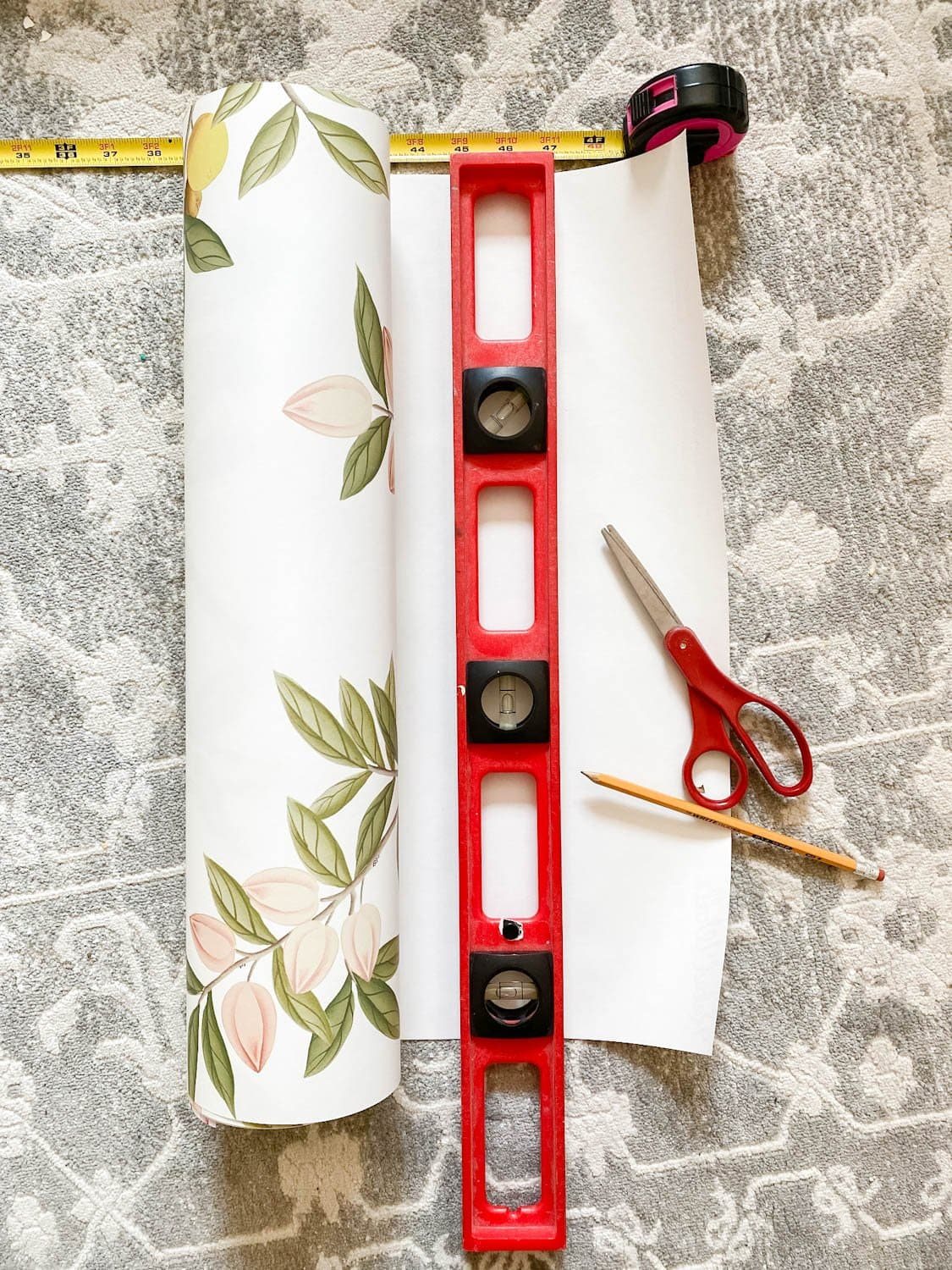 measuring and cutting wallpaper