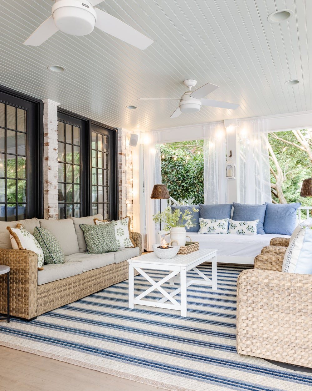 outdoor living room with fireplace on a back porch