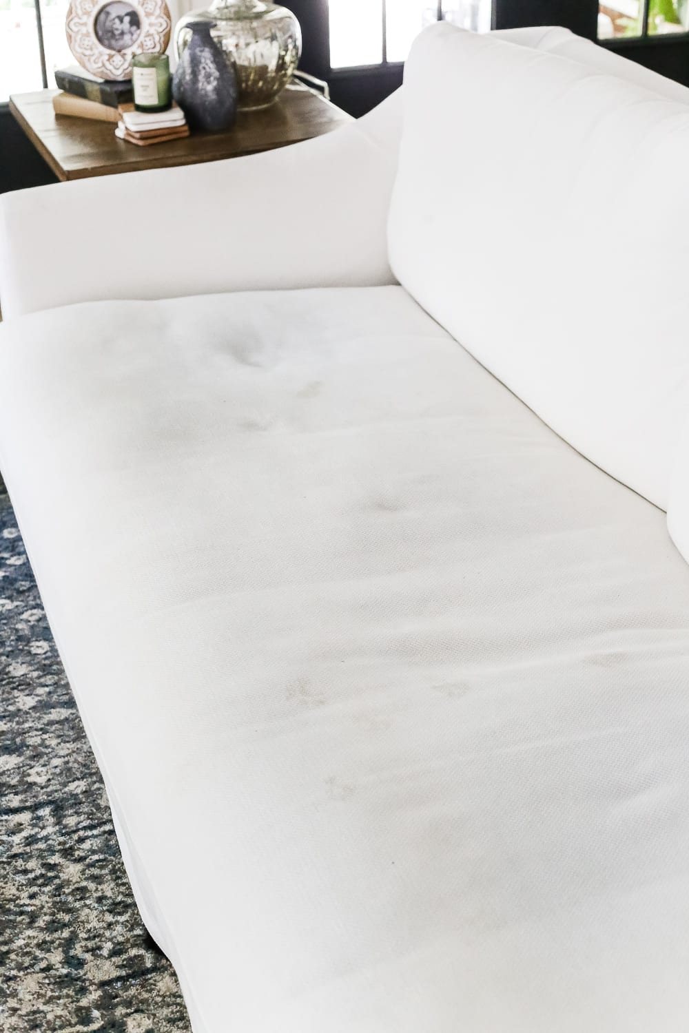 A complete review the IKEA Farlov sofa- how it holds up after 8 months with 2 dogs and a preschooler, the pros and cons of owning one, and tips to keep it looking bright white. #sofa #ikea #farlov #slipcover #furniture #livingroom