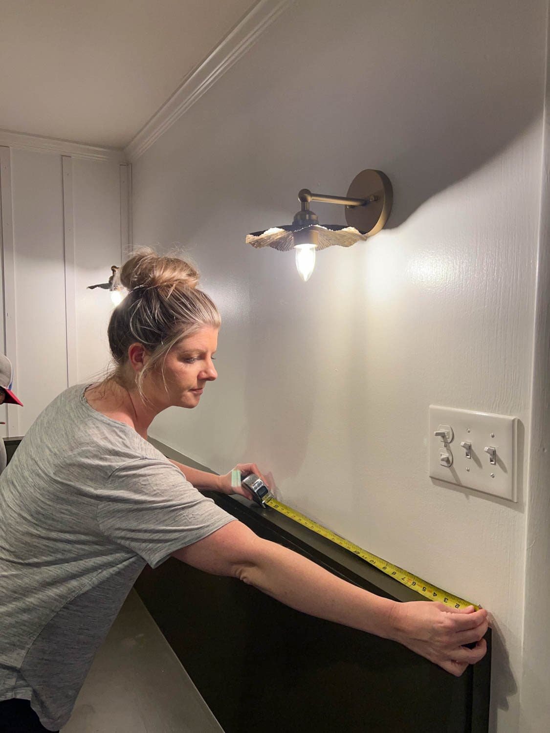 measuring a wall to place lattice strips for a DIY batten wall