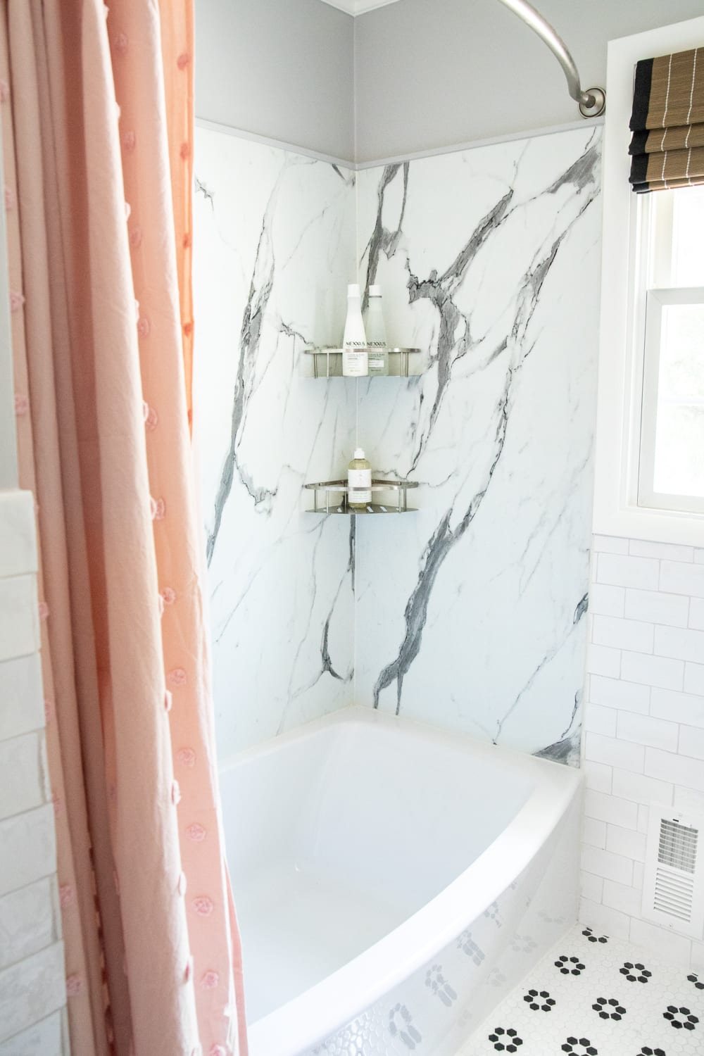 Whimsical, classic kids bathroom makeover | faux marble shower walls from American Standard Passage Collection