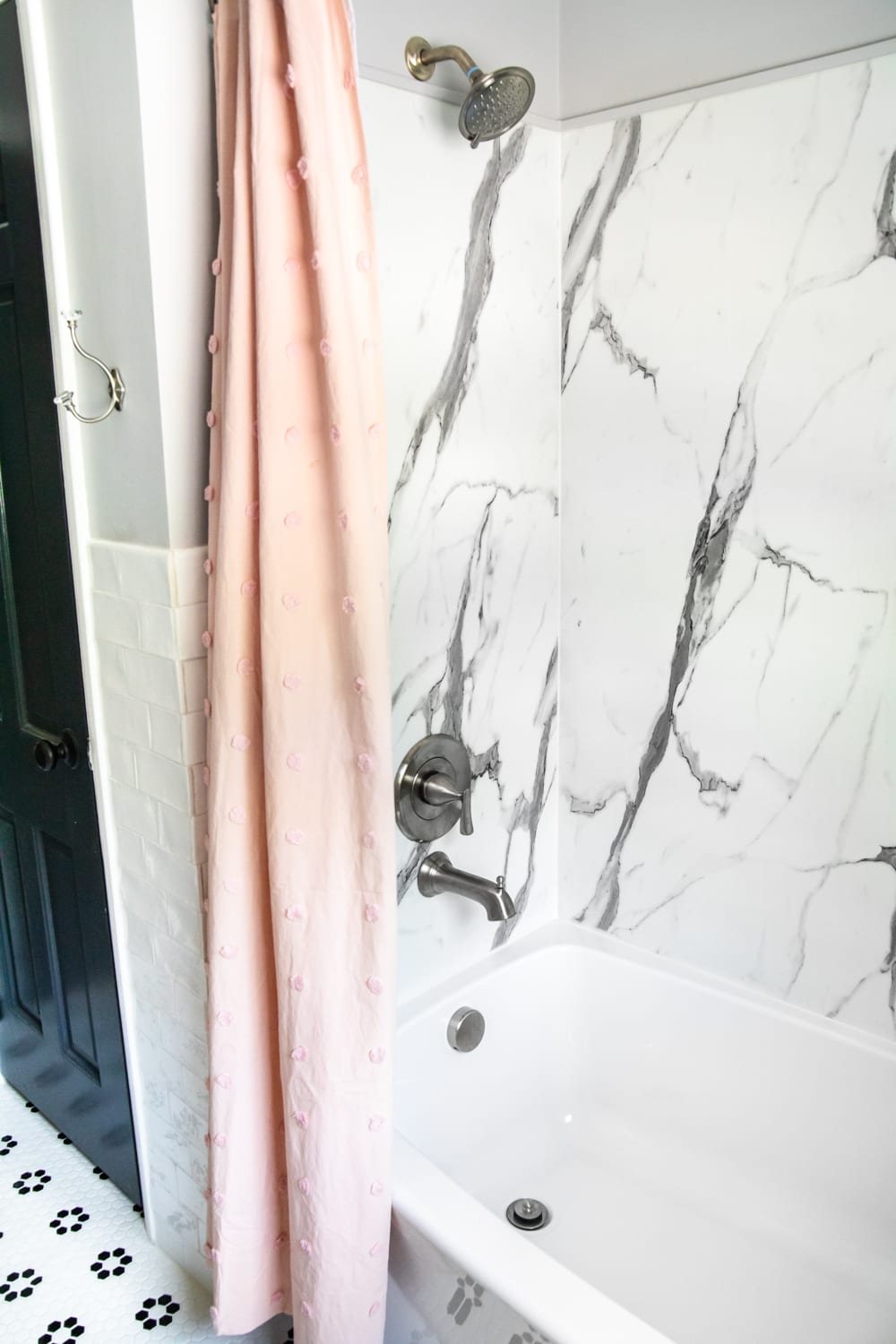 Whimsical, classic kids bathroom makeover | faux marble shower walls
