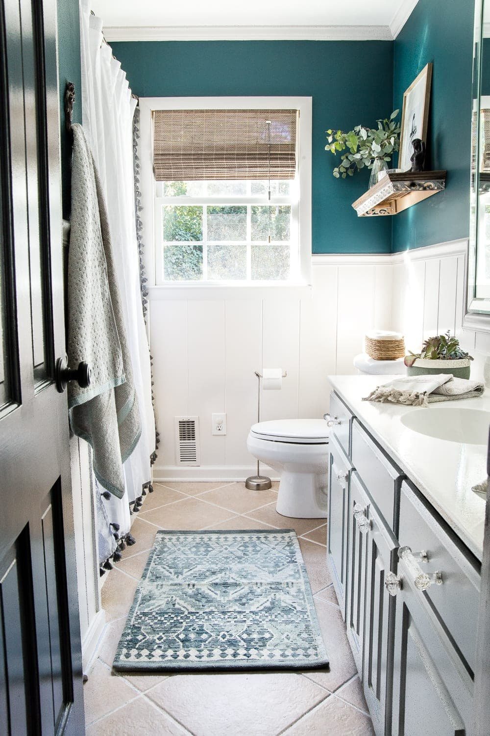 guest bathroom after with teal walls