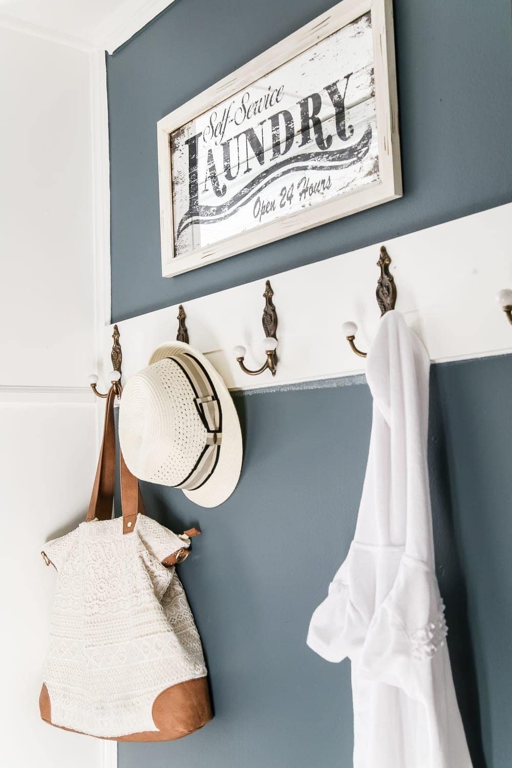 Laundry Room Updates: French Bifold Door | unigumushane.com - A rickity laundry room bifold door gets a beautiful and functional update with a French bifold door with frosted glass for hiding messes in a stylish way.