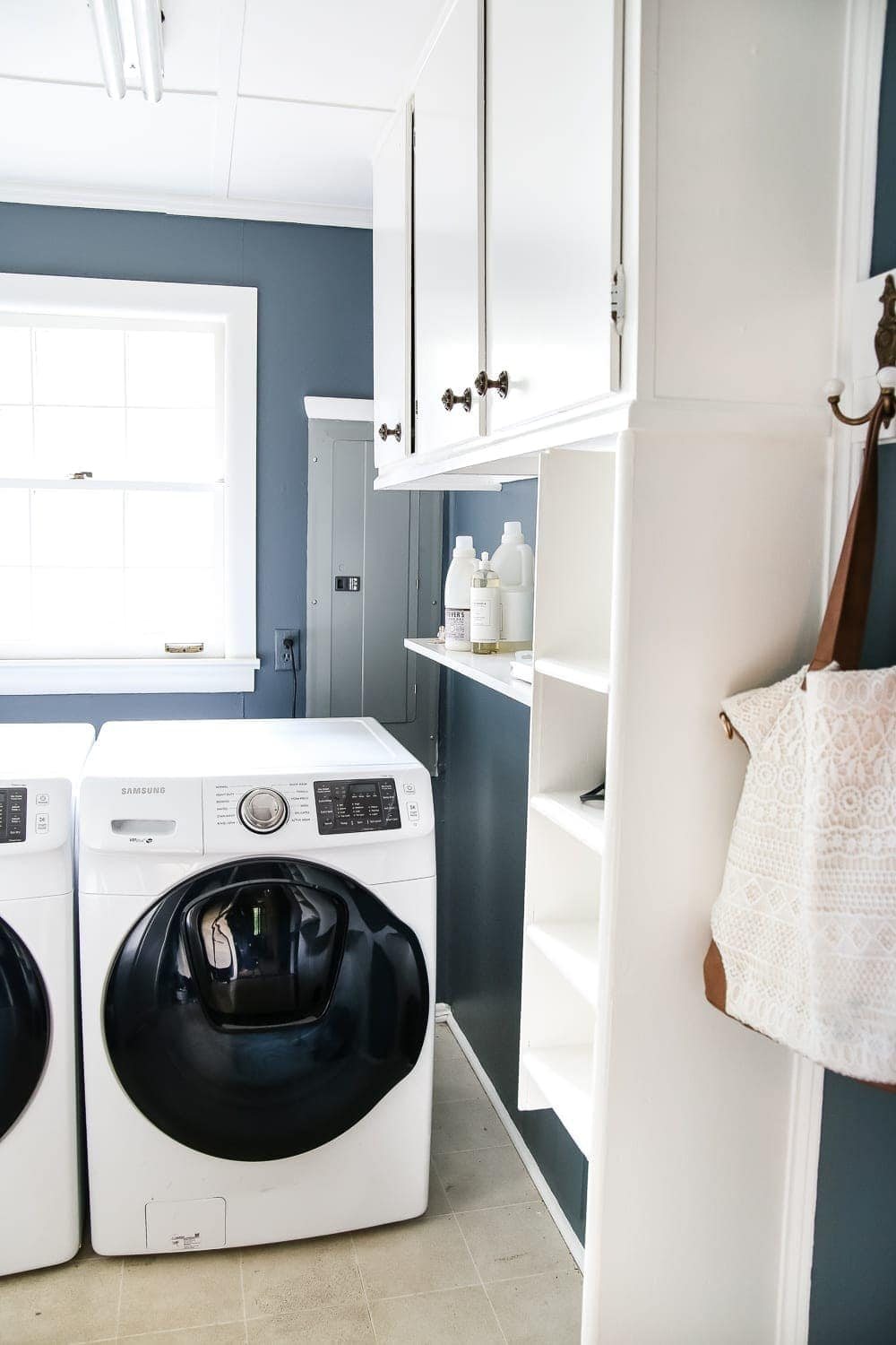 Laundry Room Updates: French Bifold Door | unigumushane.com - A rickity laundry room bifold door gets a beautiful and functional update with a French bifold door with frosted glass for hiding messes in a stylish way.