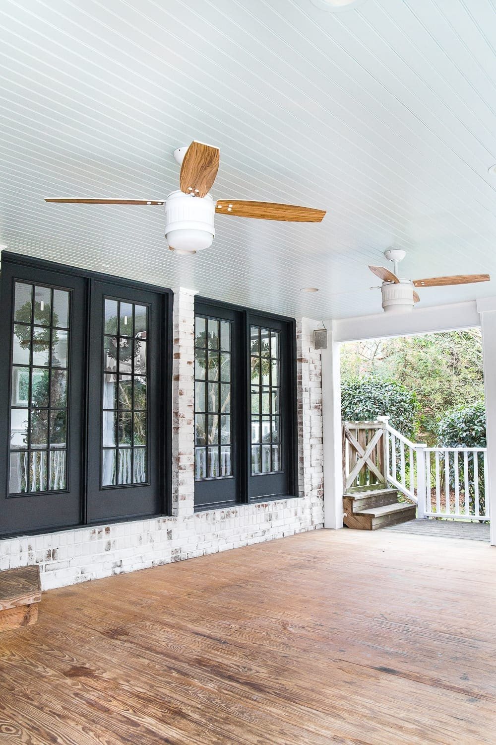 limewashed brick black French doors and haint blue porch ceiling