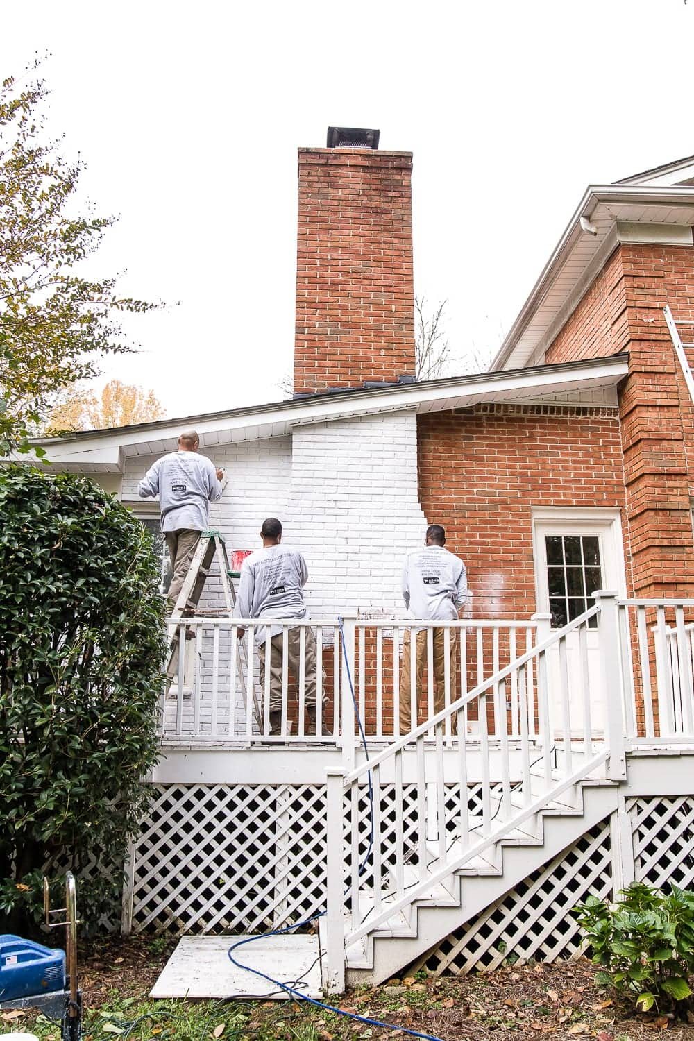limewash brick paint application on damp natural brick