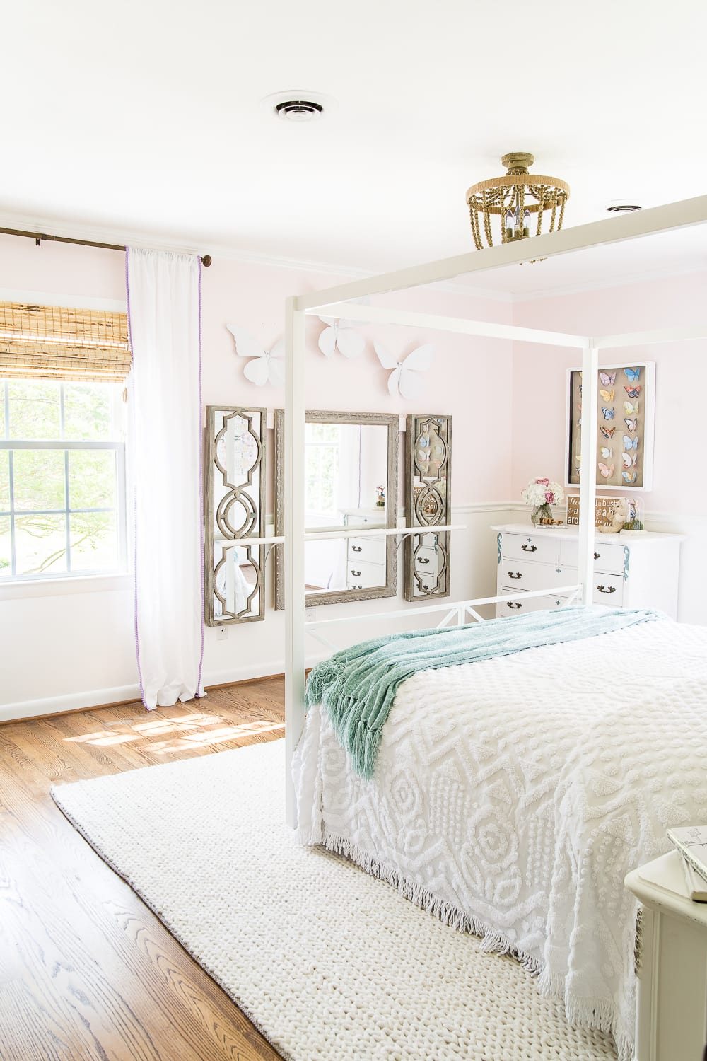 A little girl bedroom makeover with a butterfly theme full of thrifty makeovers, DIYable projects, and Anthropologie style knock-offs. #girlbedroom #littlegirlbedroom #girlroom #littlegirlroom #kidsspaces #kidsdecor #kidsroom #kidsdiy #bedroommakeover #kidsroommakeover #girlbedroommakeover