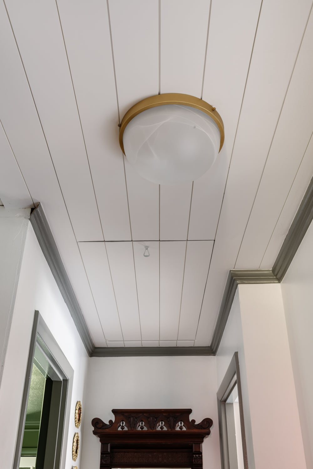 tongue and groove ceiling with hidden attic door