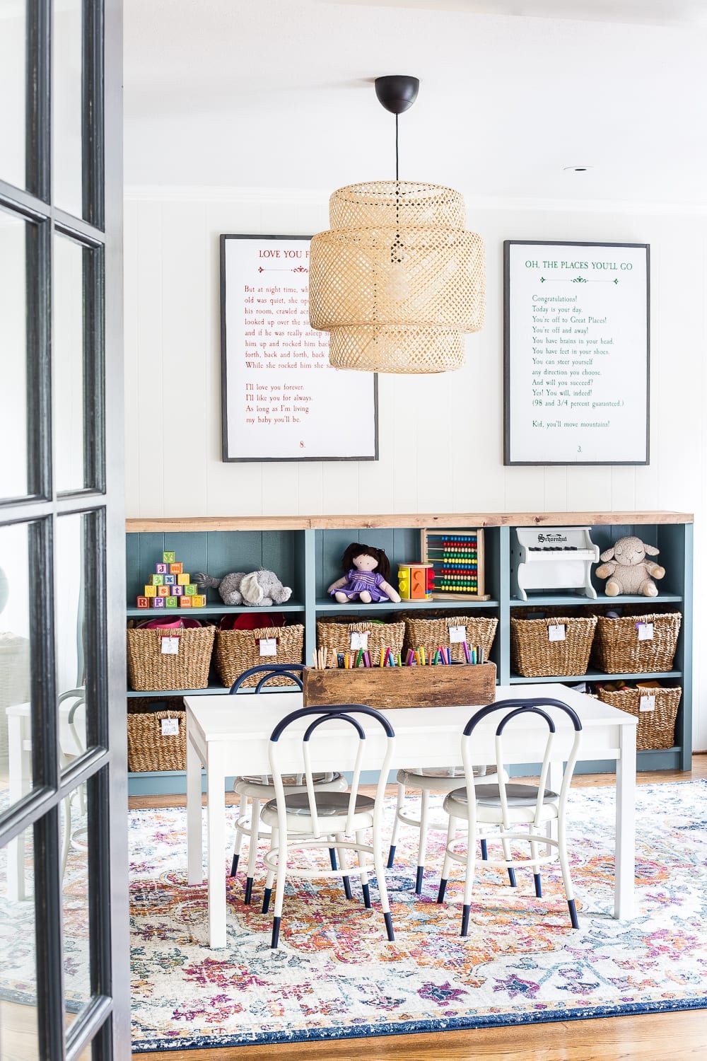 A dated, unorganized playroom gets a bright and whimsical makeover with organizational strategies, ideas for adding function, and DIY-able projects to create the perfect kid's space on a budget. #kidsroom #playroom #kidsdecor #toyorganizing