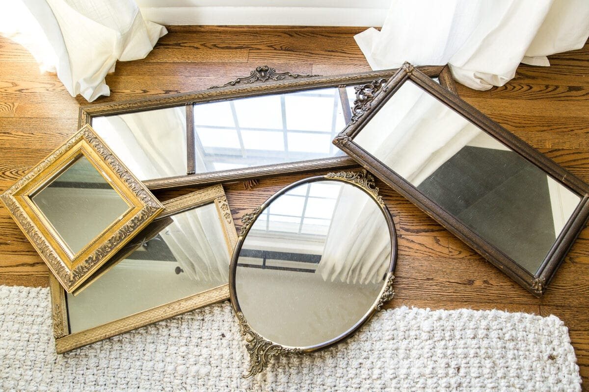 A couple of tricks for hanging the perfect mirror gallery wall plus ideas for a traditional meets modern eclectic dining room. #diningroom #gallerywall #walldecor #mirrors
