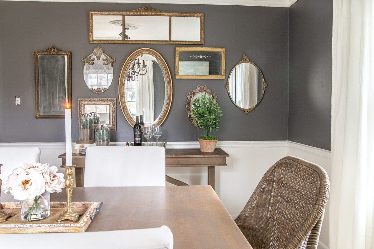 A couple of tricks for hanging the perfect mirror gallery wall plus ideas for a traditional meets modern eclectic dining room. #diningroom #gallerywall #walldecor #mirrors