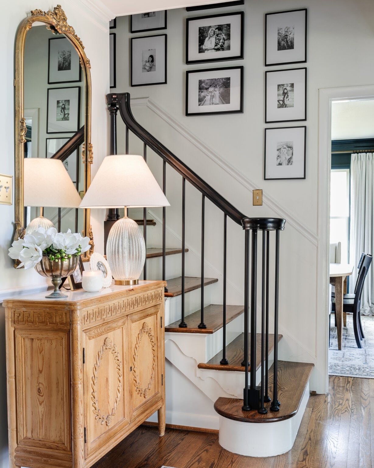 family gallery wall on a staircase in black and white frames