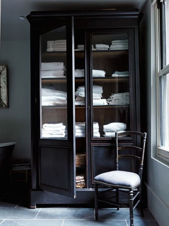 black linen cabinet with wood interior