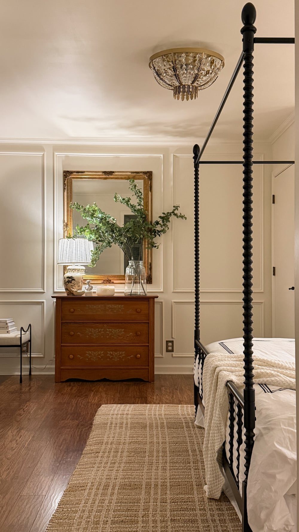 classic modern french country bedroom with layered lighting and canopy bed
