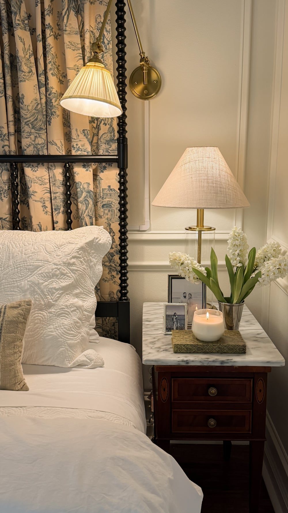 classic modern french country bedroom with layered lighting and canopy bed