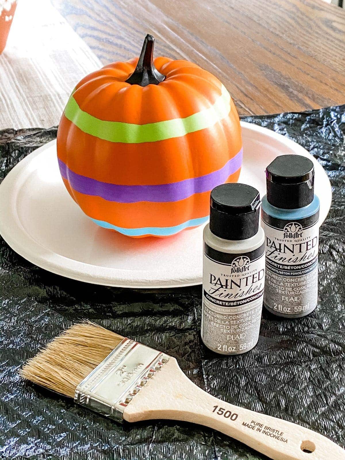fake pumpkin painted to look like concrete