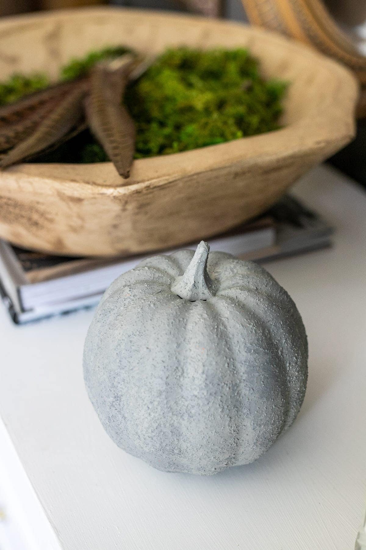 fake pumpkin painted to look like concrete