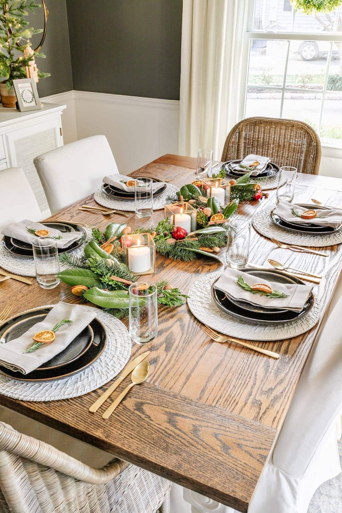 Christmas table decor with fresh garland and dried citrus