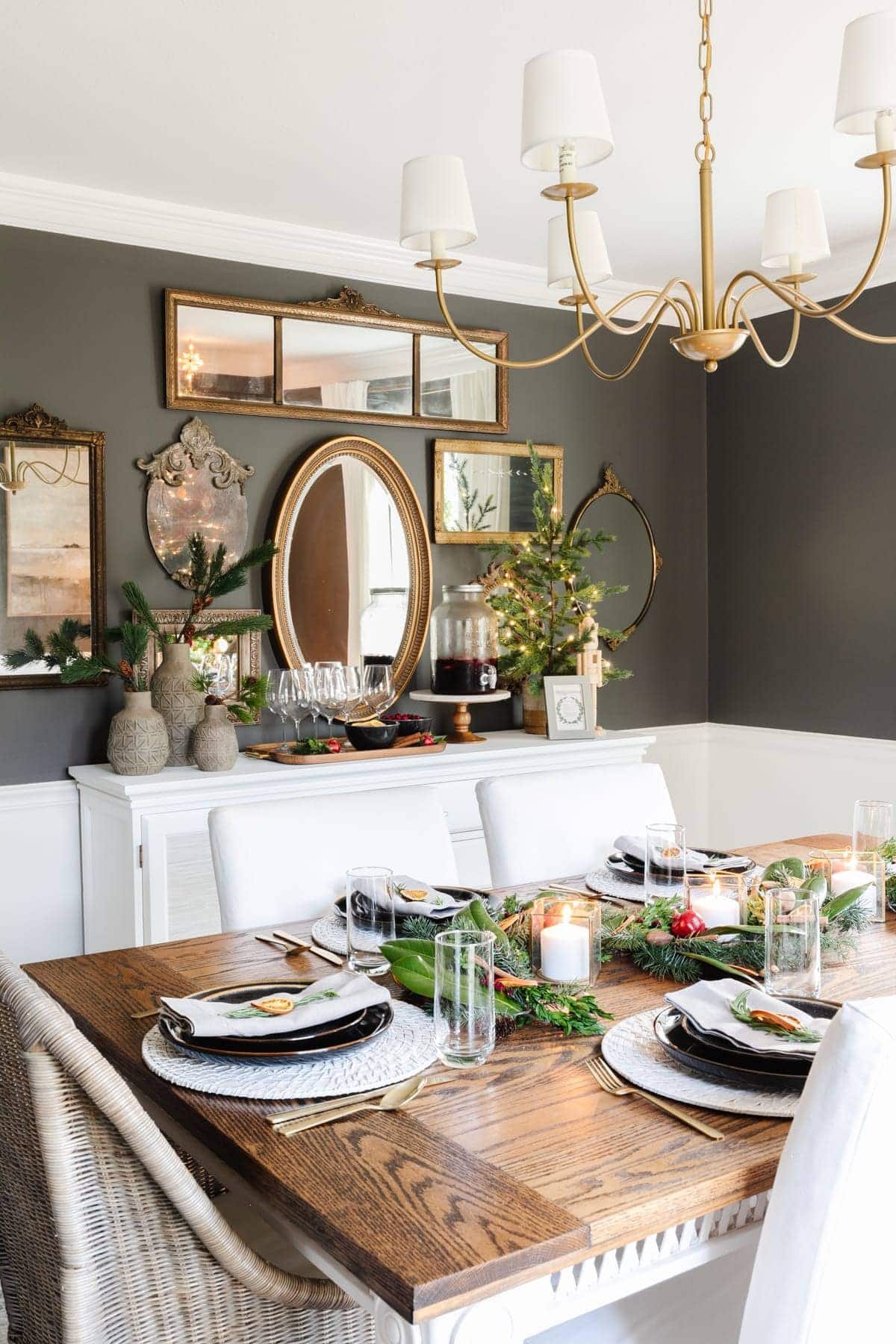 Dining room decorated for Christmas with mirror gallery wall