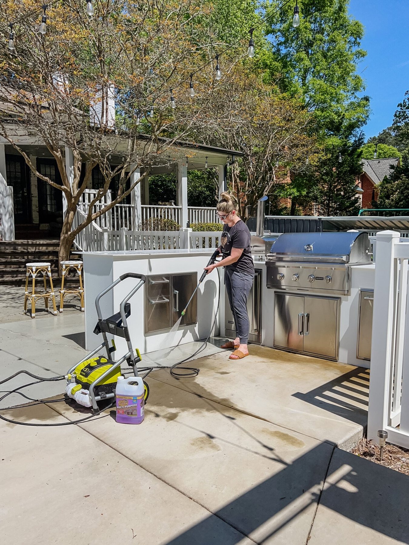 cleaning backyard patio concrete with a pressure washer and krud kutter