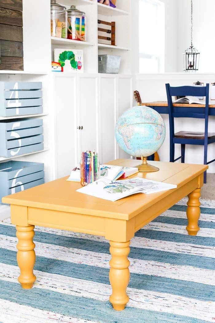 Mustard Playroom Coffee Table Makeover | unigumushane.com - An old thrifted wooden coffee table gets a bright and cheerful makeover using Fusion Mineral Paint in Mustard for a fun addition to a playroom.