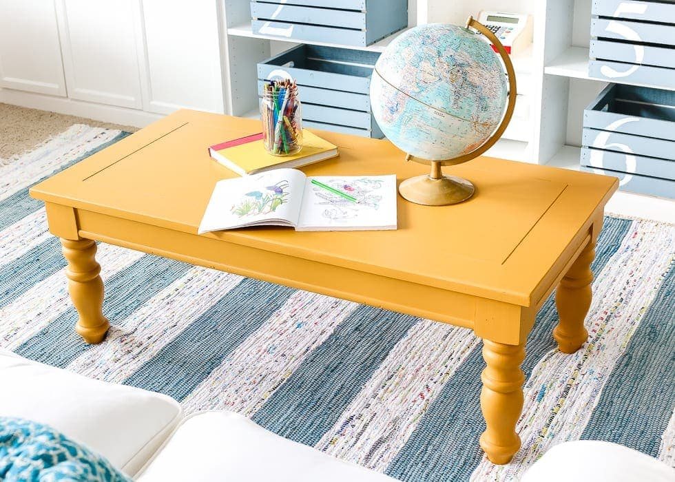 Mustard Playroom Coffee Table Makeover | unigumushane.com - An old thrifted wooden coffee table gets a bright and cheerful makeover using Fusion Mineral Paint in Mustard for a fun addition to a playroom.