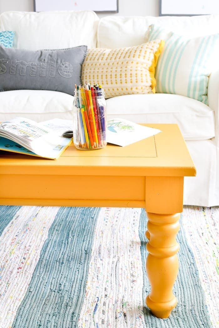 Mustard Playroom Coffee Table Makeover | unigumushane.com - An old thrifted wooden coffee table gets a bright and cheerful makeover using Fusion Mineral Paint in Mustard for a fun addition to a playroom.