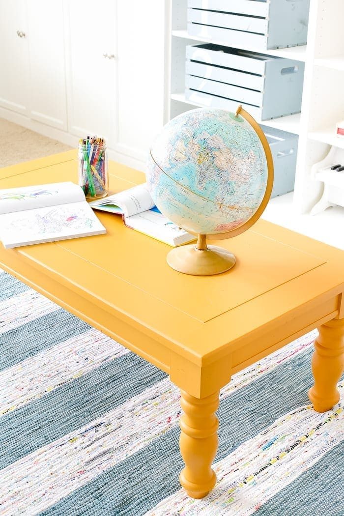Mustard Playroom Coffee Table Makeover | unigumushane.com - An old thrifted wooden coffee table gets a bright and cheerful makeover using Fusion Mineral Paint in Mustard for a fun addition to a playroom.