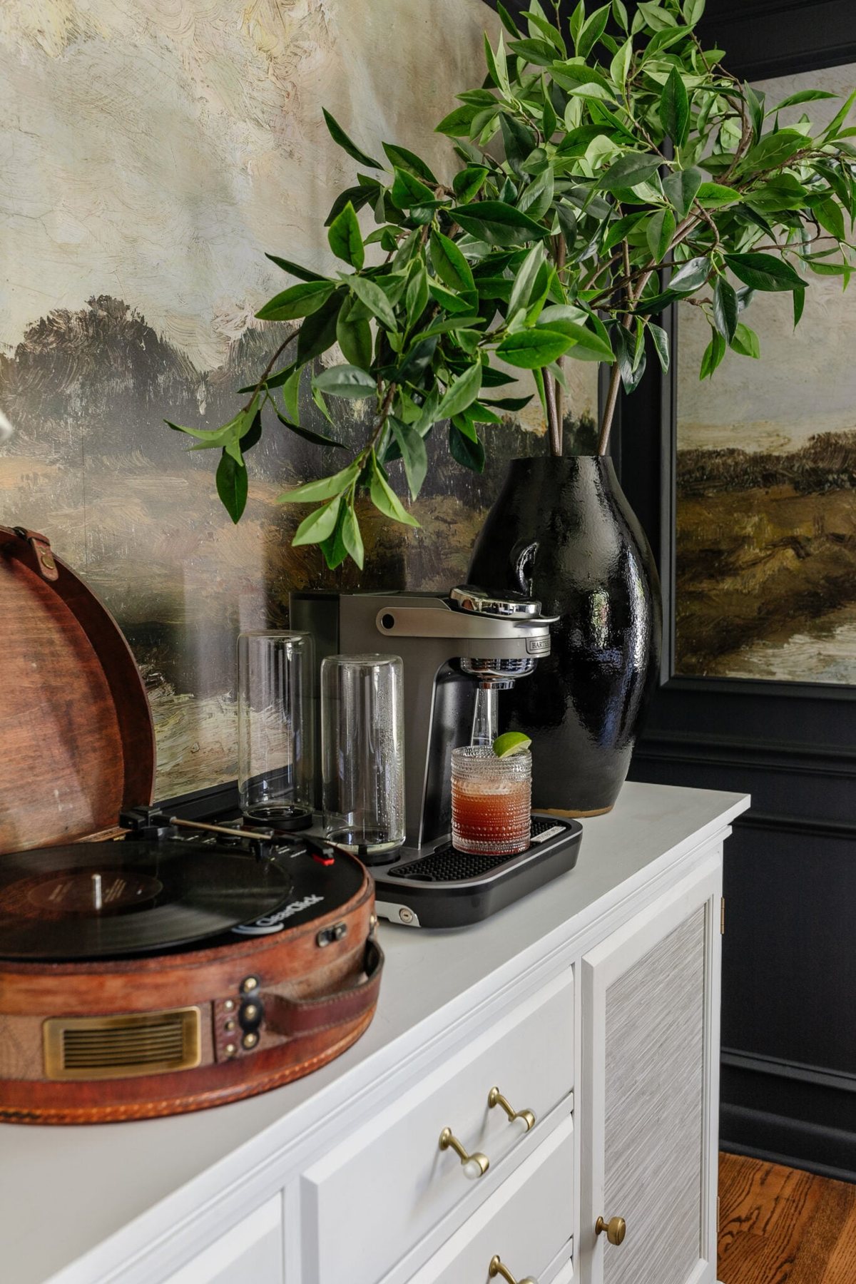 bartesian cocktail machine used on top of a dining room sideboard