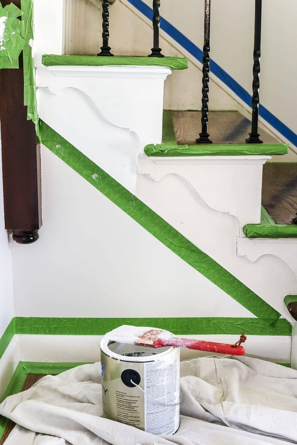Neutral Painted Foyer Update | unigumushane.com - A drab, dated foyer and staircase get a bright, neutral facelift with high contrast details using Benjamin Moore colors Classic Gray and Wrought Iron.