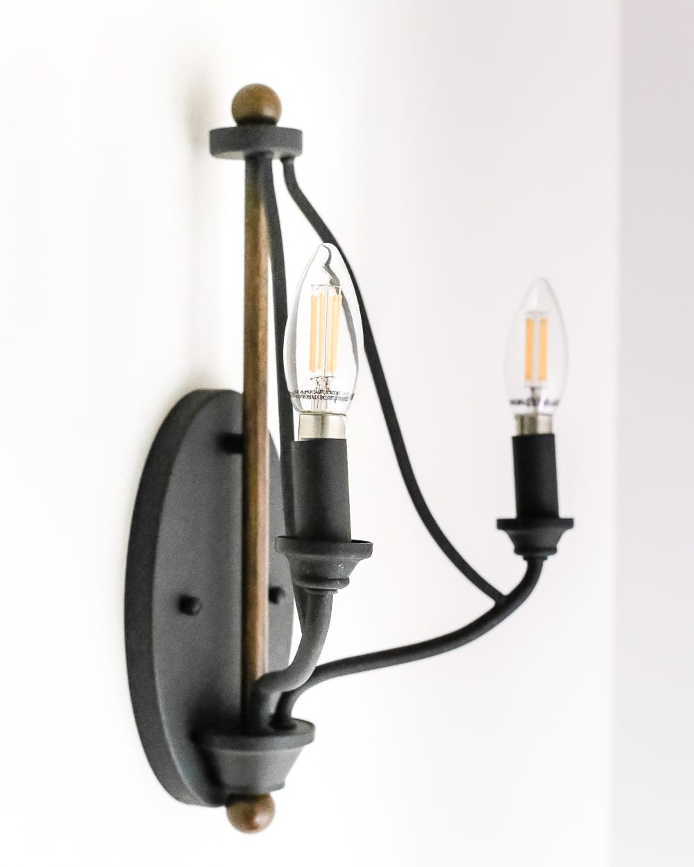Neutral Painted Foyer Update | unigumushane.com - A drab, dated foyer and staircase get a bright, neutral facelift with high contrast details using Benjamin Moore colors Classic Gray and Wrought Iron.