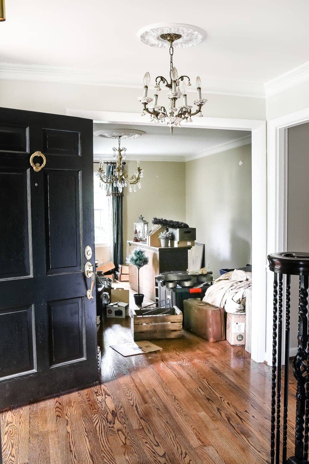 Neutral Painted Foyer Update | unigumushane.com - A drab, dated foyer and staircase get a bright, neutral facelift with high contrast details using Benjamin Moore colors Classic Gray and Wrought Iron.