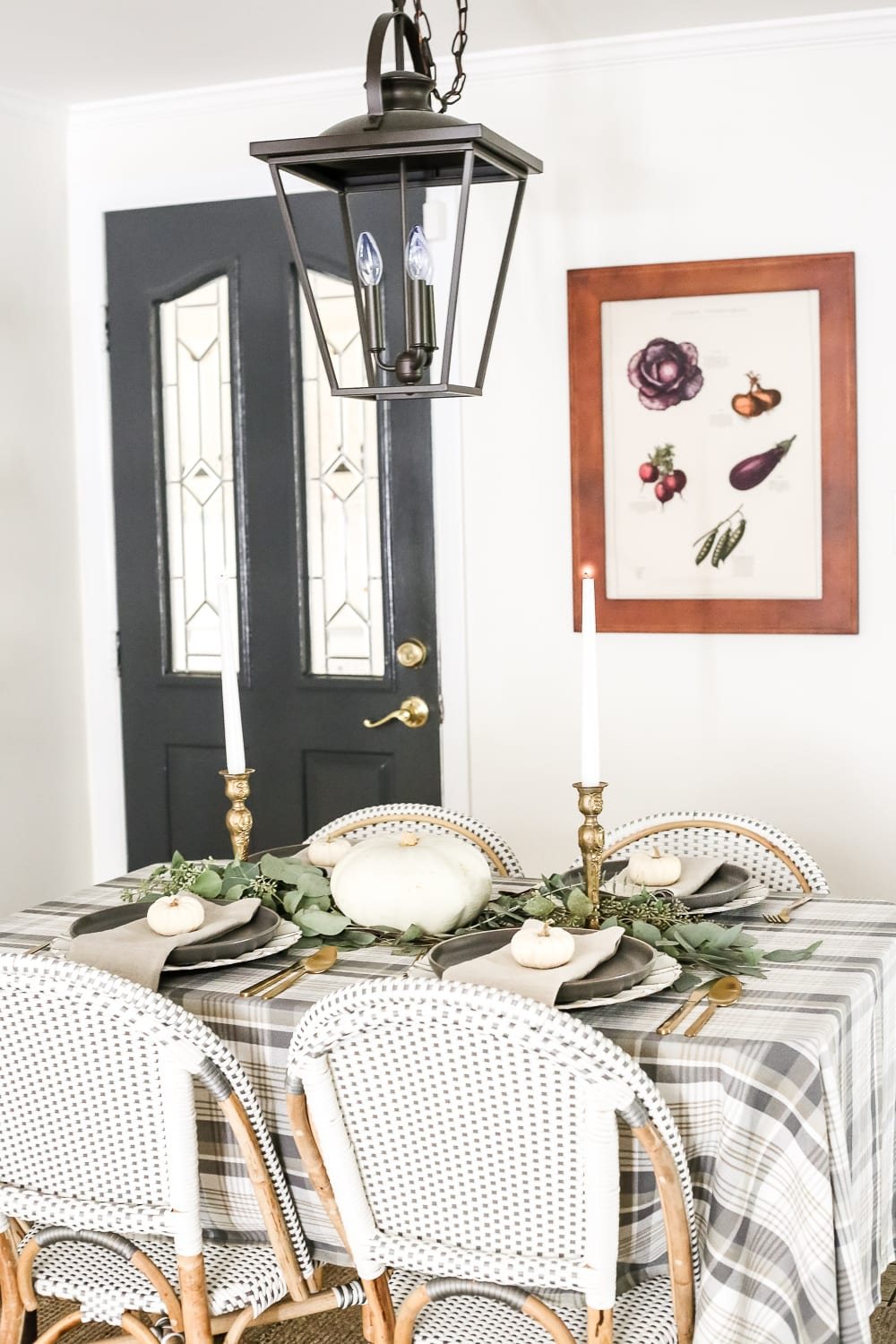 Neutral Low-Key Thanksgiving Tablescape | unigumushane.com - A neutral low-key Thanksgiving tablescape that is simple and inexpensive to recreate using plaid fabric, white pumpkins, eucalyptus, and brass.