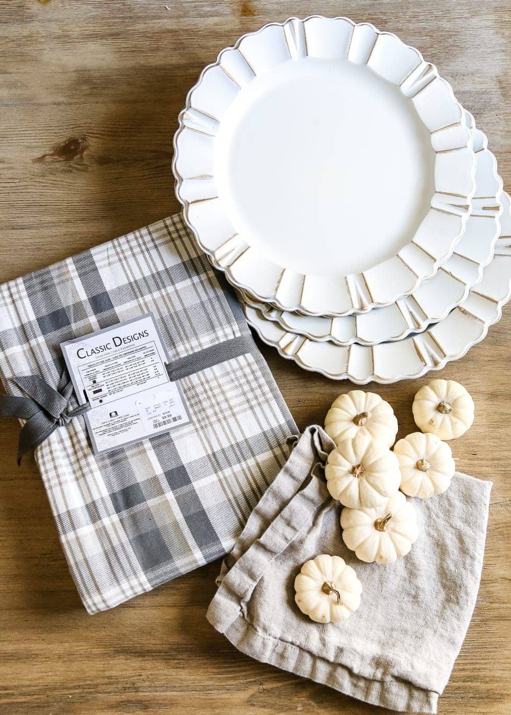 Neutral Low-Key Thanksgiving Tablescape | unigumushane.com - A neutral low-key Thanksgiving tablescape that is simple and inexpensive to recreate using plaid fabric, white pumpkins, eucalyptus, and brass.
