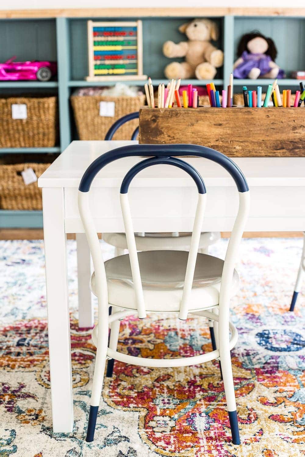 A playroom makeover with bamboo light fixture, adjustable play table, and miniature French bistro chairs. #playroom #kidsdecor