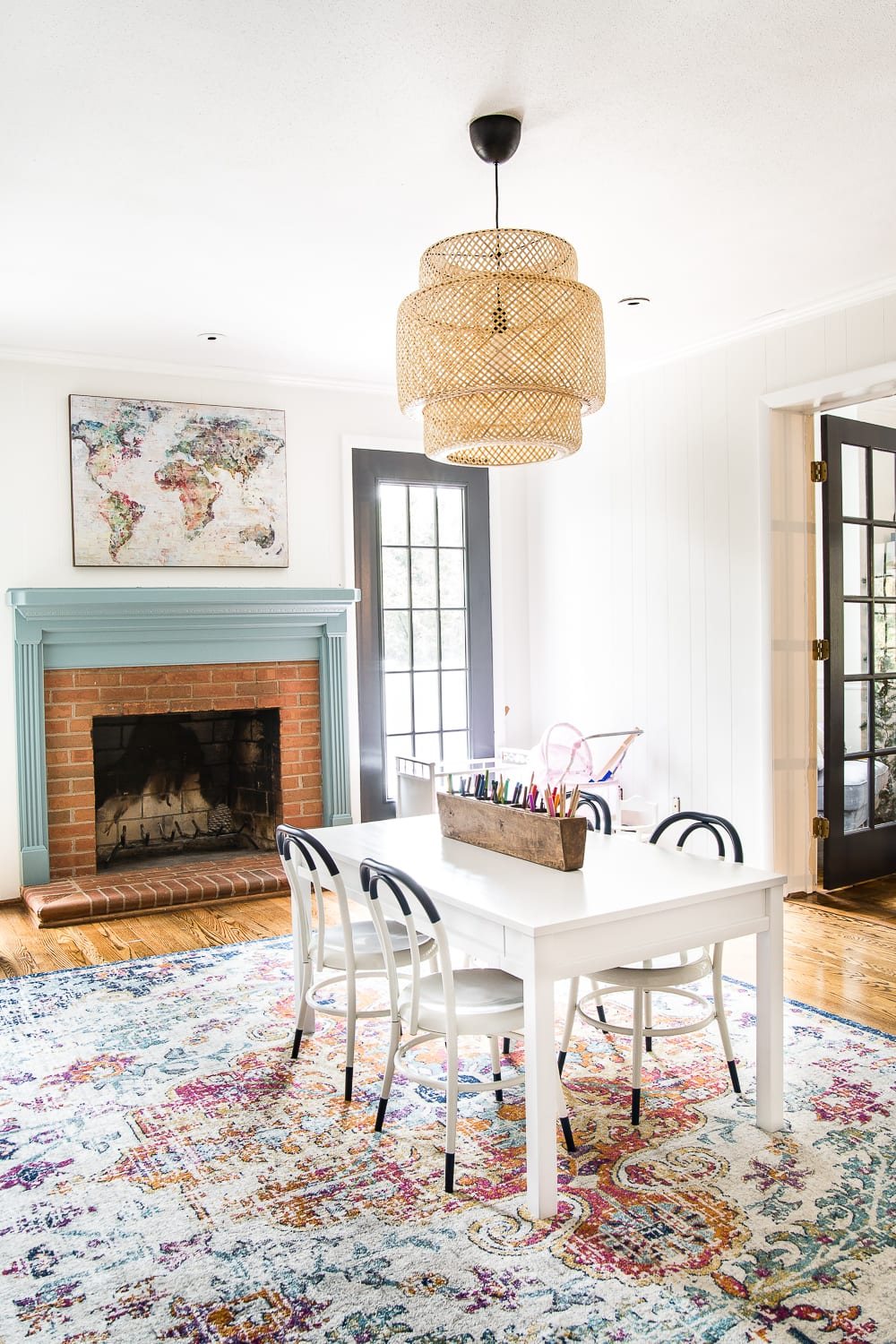 A playroom makeover with bamboo light fixture, adjustable play table, and miniature French bistro chairs. #playroom #kidsdecor