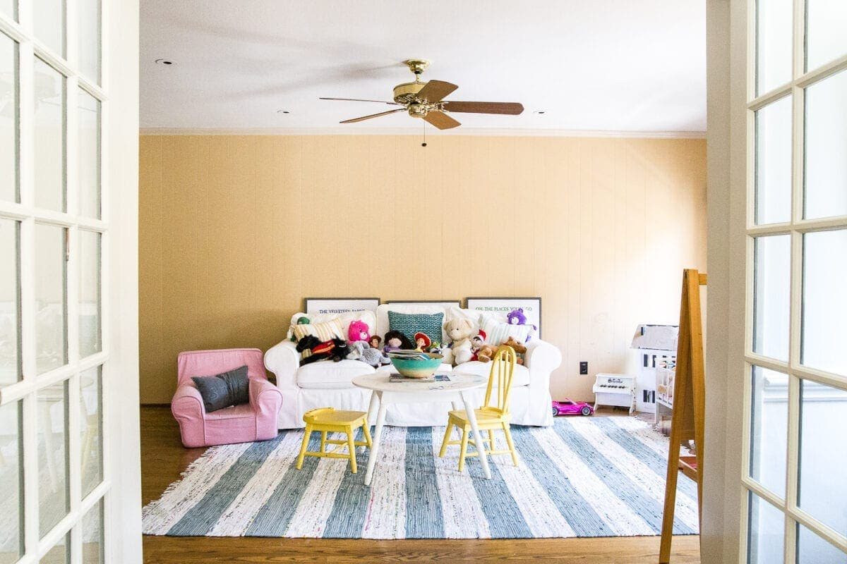 A playroom makeover with bamboo light fixture, adjustable play table, and miniature French bistro chairs. #playroom #kidsdecor