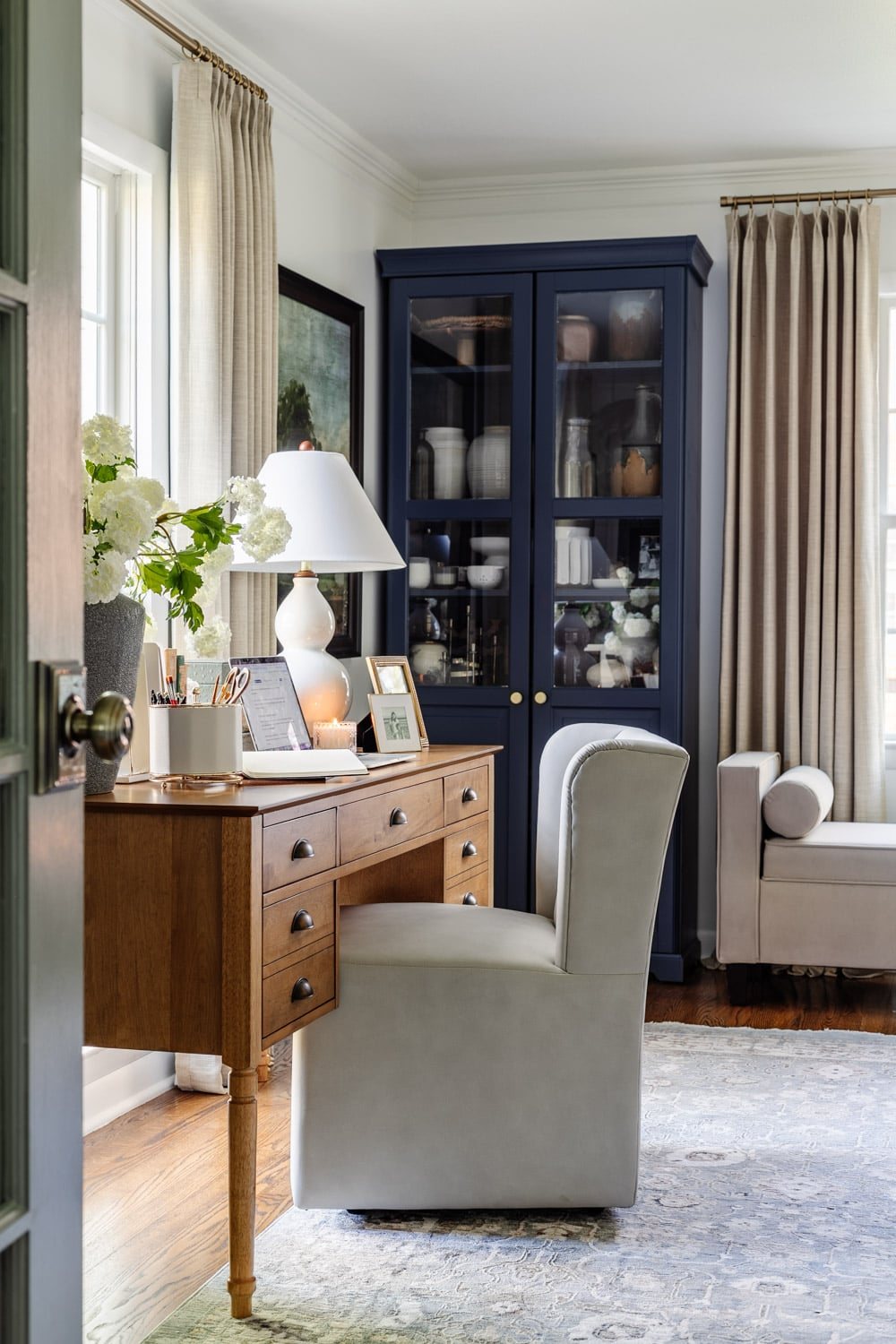 home office blue ikea cabinets desk in front of window